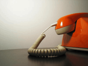 A red teleophone with white wires
